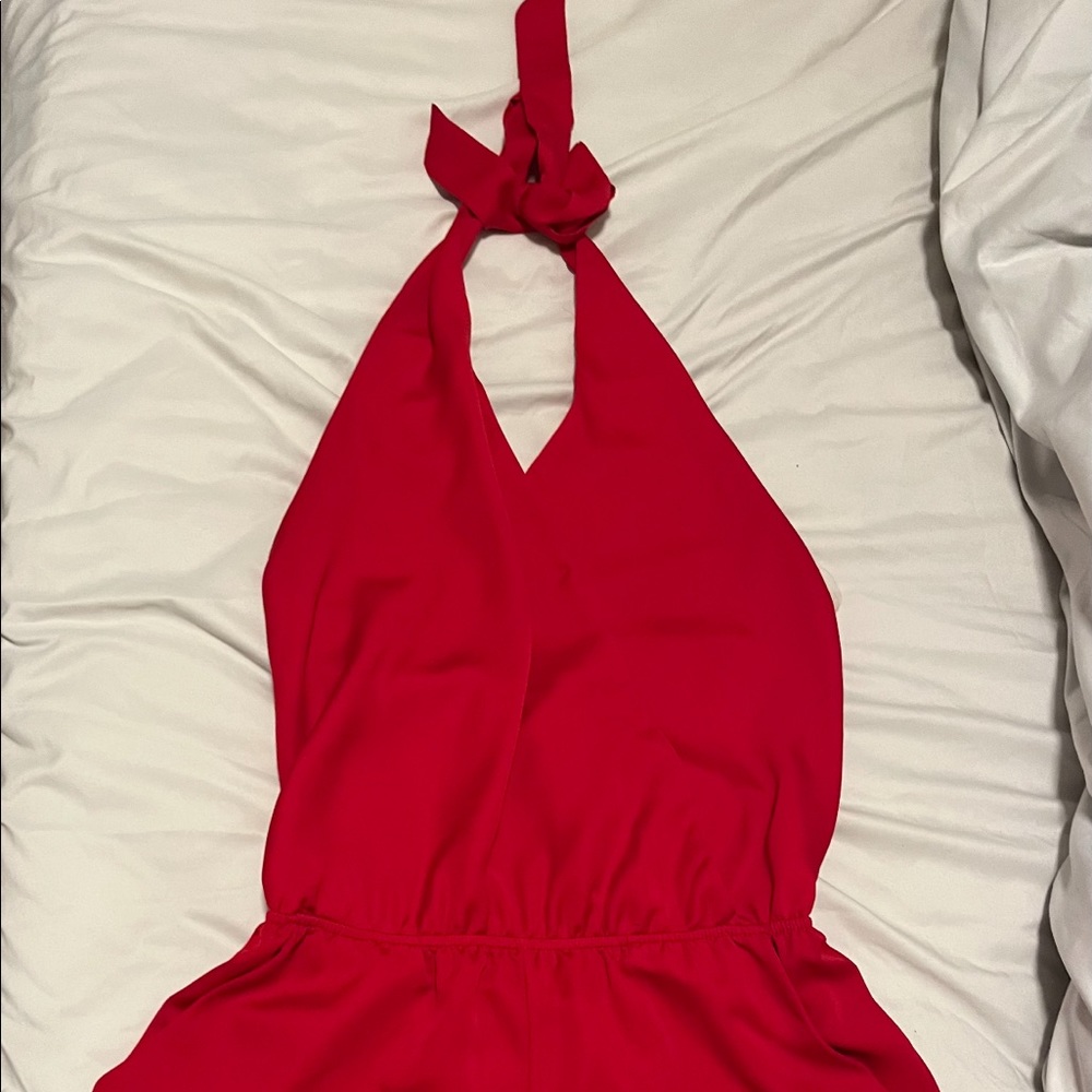 Red halter-top romper with an open back